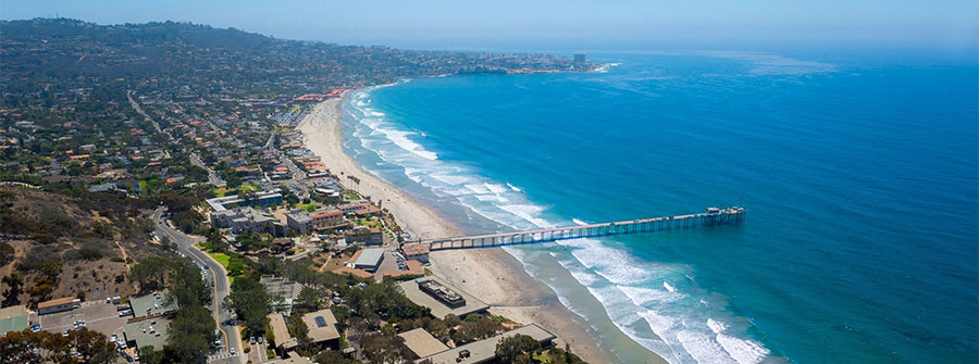 Aerial view of Scripps Pier and La Jolla coastal community surrounding UC San Diego